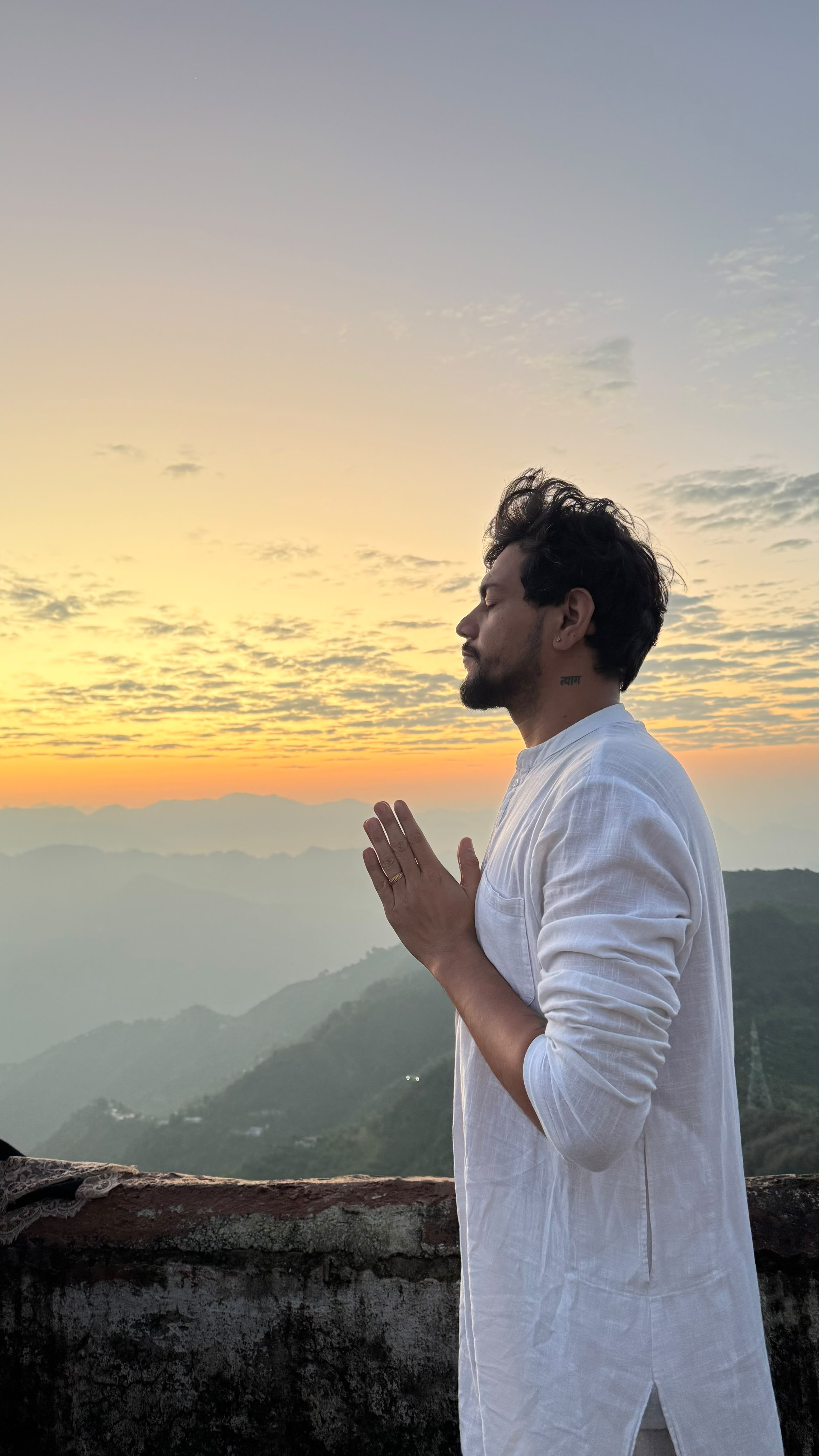 Arun Maan practising yoga outdoors at sunset