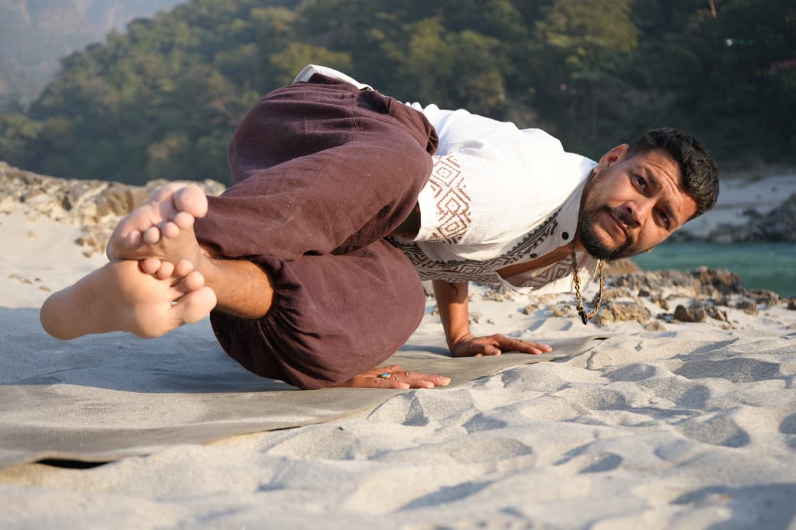 Arun Maan smiling in a mountain landscape in India